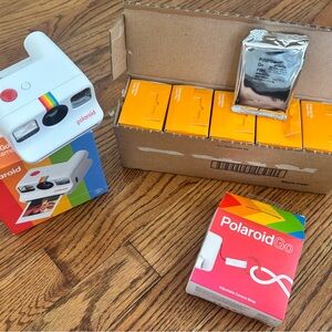 Polaroid Go Instant Camera with film and camera strap